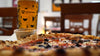 Fresh pint of beer and Pizza Geeks pizza at Moonwake taproom in Leith